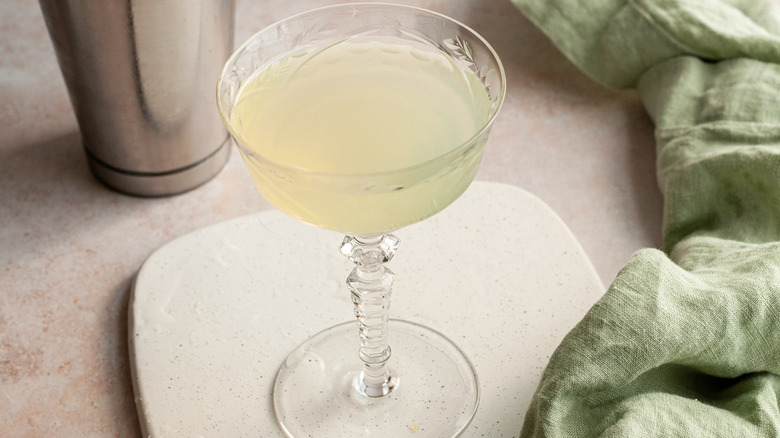 green cocktail in stemmed glass