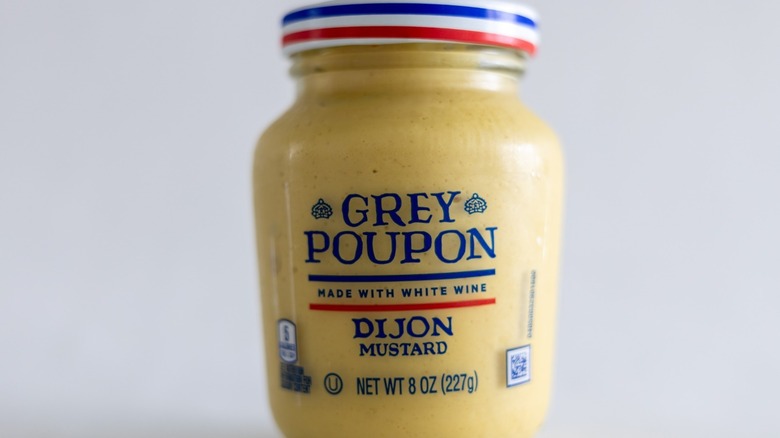 A jar of Grey Poupon Dijon Mustard
