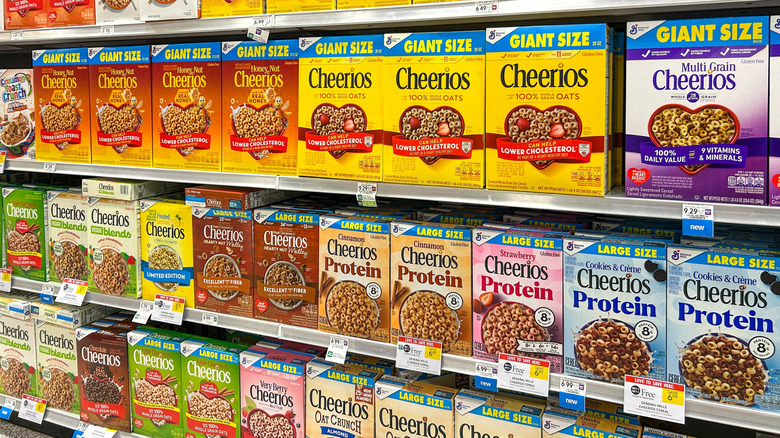 Rows of Cheerios on shelves in grocery store