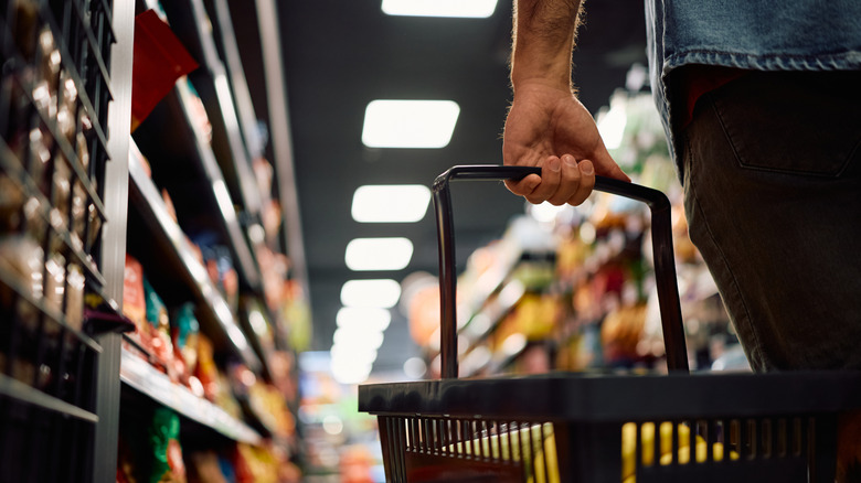 man holding a basket shopping