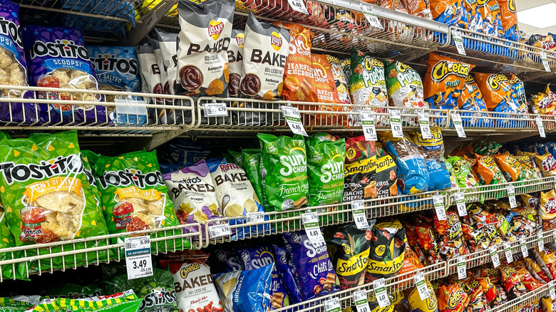 grocery shelves filled with frito-lay snacks