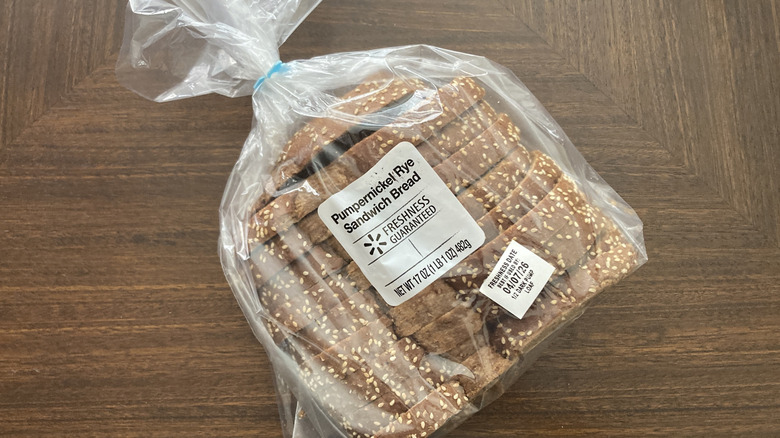 Freshness Guaranteed Pumpernickel Rye bread in packaging on table