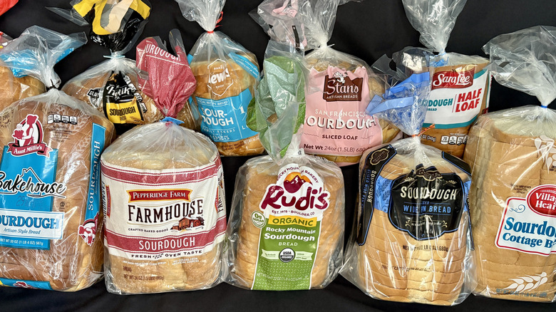 bagged loaves of bread on black background