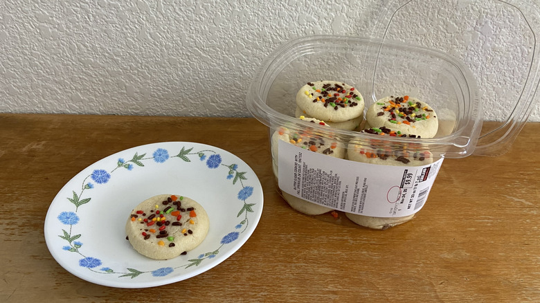 Kirkland sugar cookie box beside single plated cookie