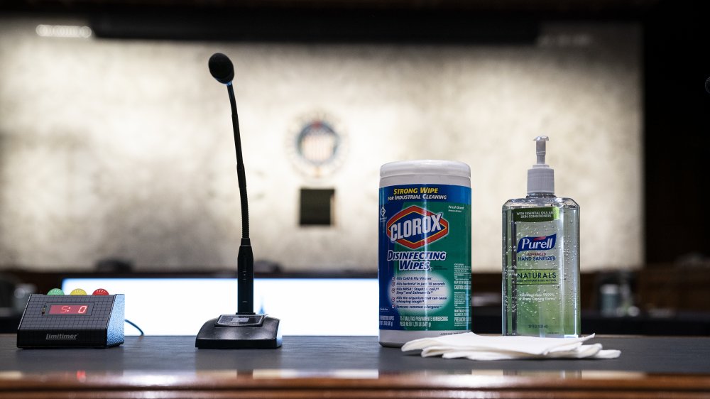 sanitizing products on a podium