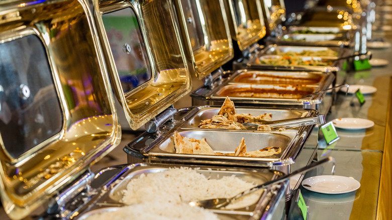 a buffet with rice and pita