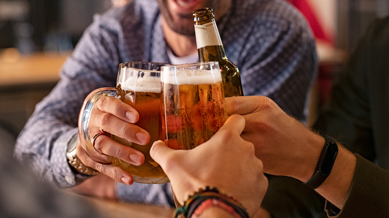 Hands holding beer