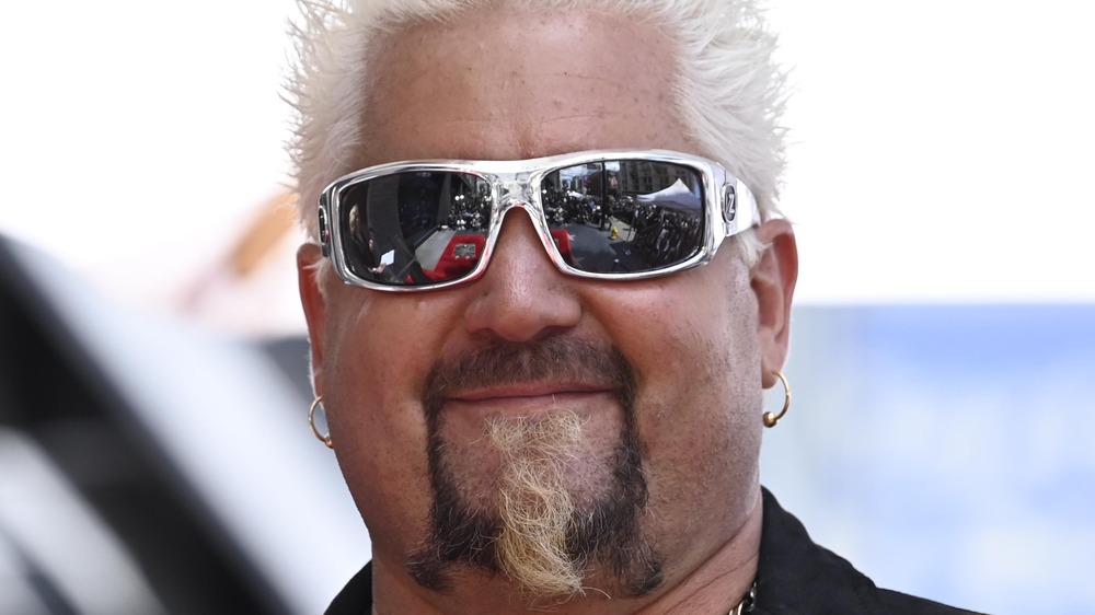 Guy Fieri with silver sunglasses on