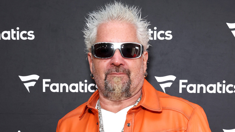 Guy Fieri at red carpet event.