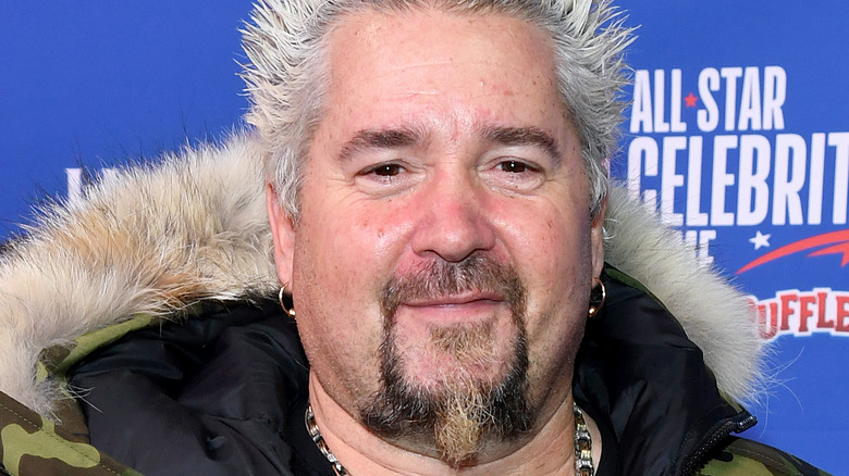 Guy Fieri smiling at event 