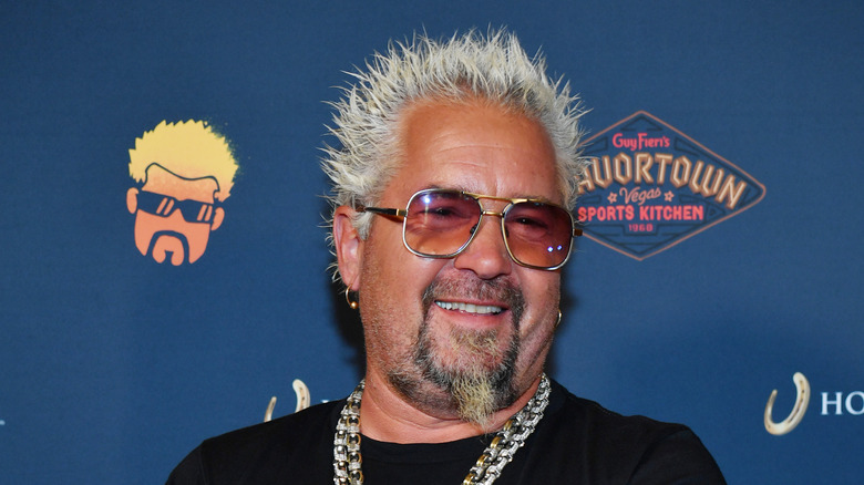 guy fieri smiling in sunglasses