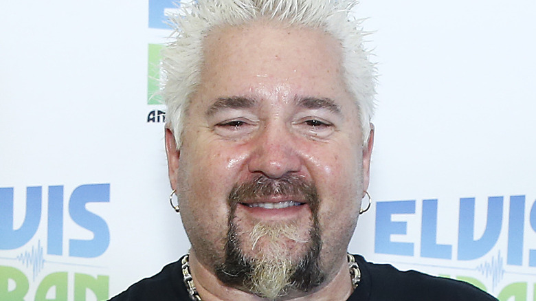 Guy Fieri smiles to the camera