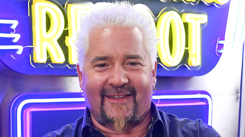 Guy Fieri posing for photo