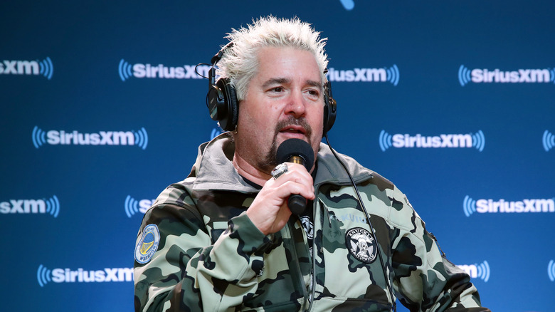 Guy Fieri with a microphone