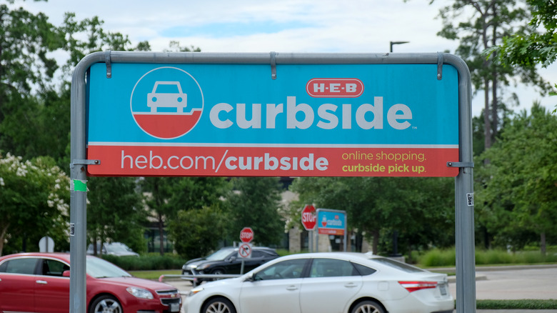 Cars parked at H-E-B curbside