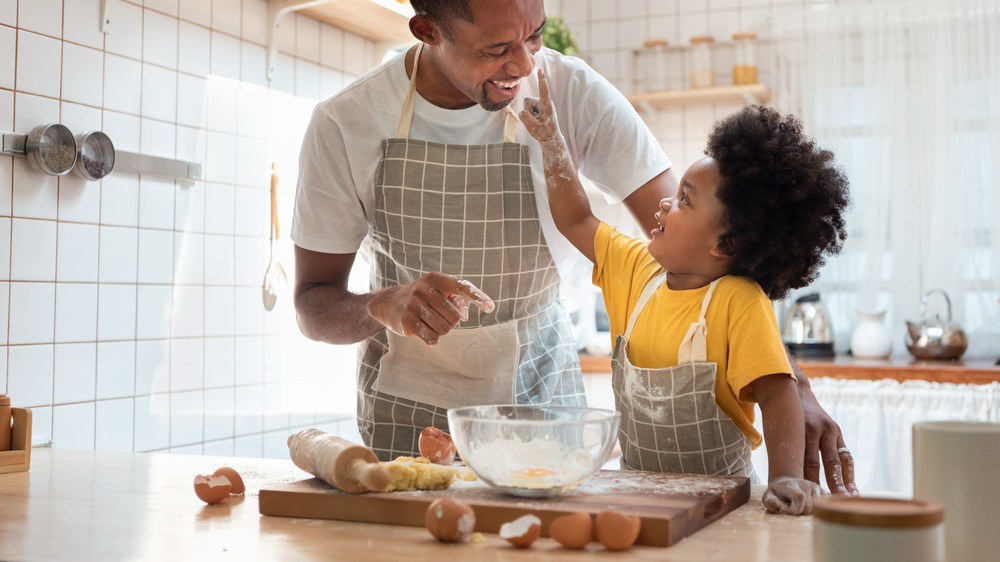 dad and son making cookies