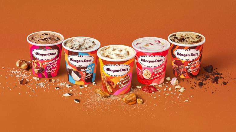 five pints of Haagen Dazs ice cream on an orange background