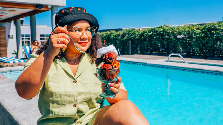 Paola Velez poolside with Häagen-Daz PB&J Sundae