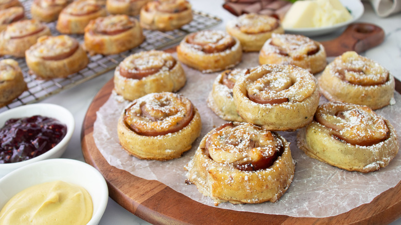 Monte Cristo pinwheels on wooden serving board and cooling rack