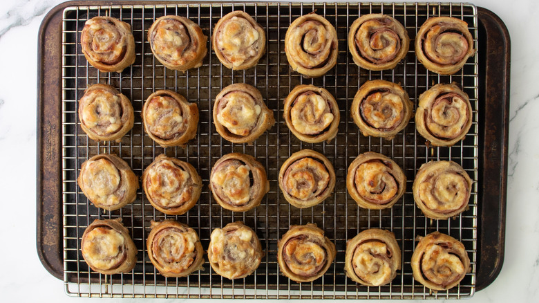 Baked pinwheels cooling on wire rack