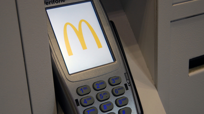 Card payment machine displaying McDonald's logo.