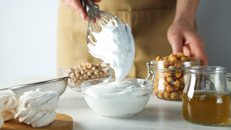 Person making aquafaba whipped cream