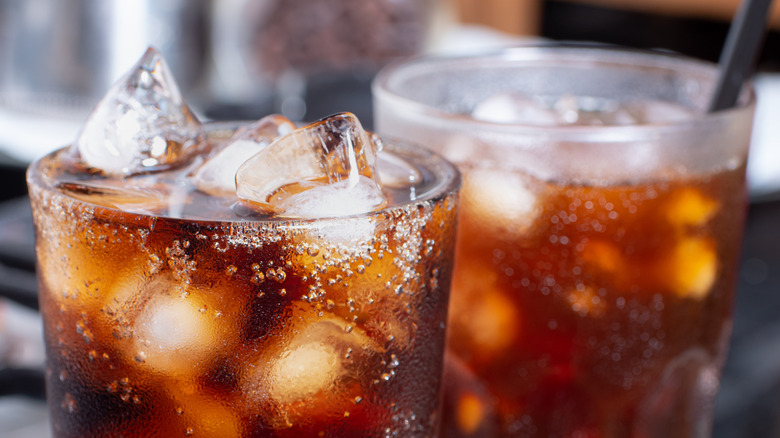 Close up of cola in glass cup with ice