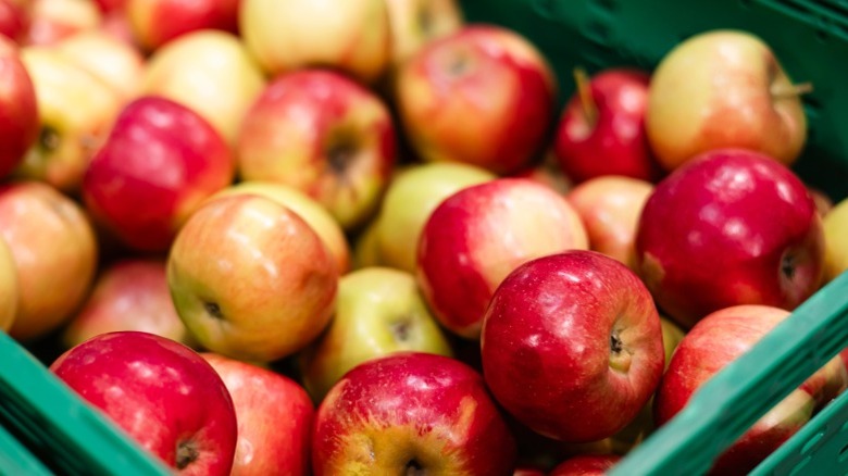 Apples in a bin at a supermarket