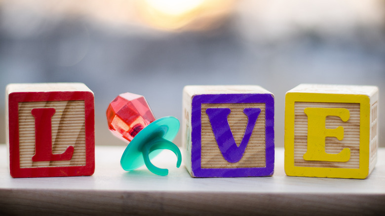 ring pop and building blocks spelling love