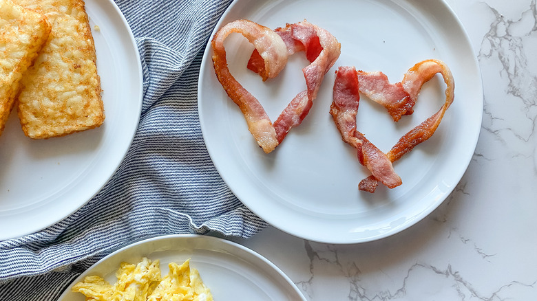 heart-shaped bacon and hashbrowns