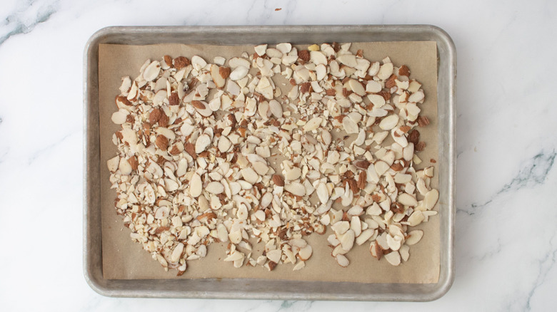 Sliced almonds on baking sheet