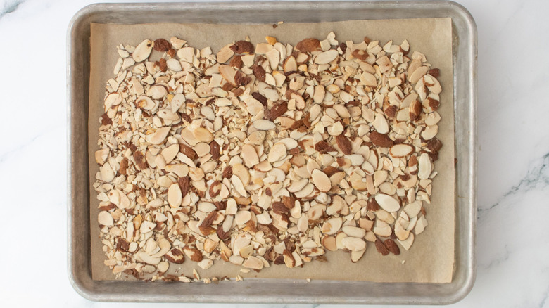 Sliced almonds on baking sheet