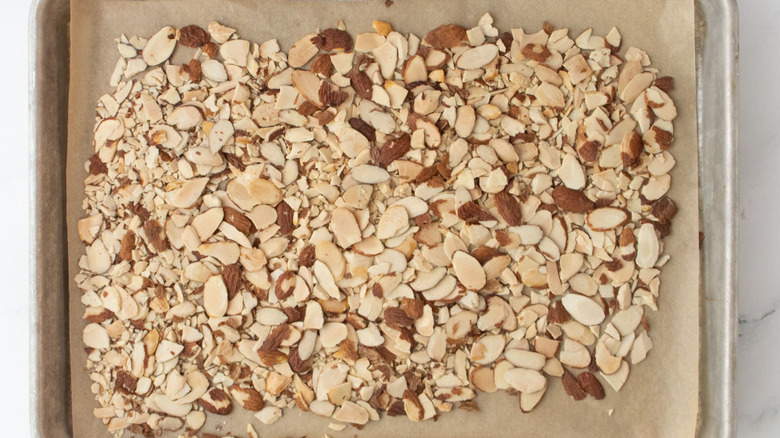 Sliced almonds on baking sheet