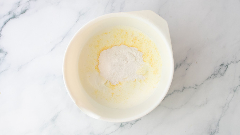 Pudding mix and milk in bowl