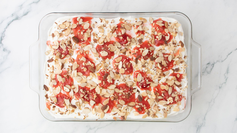 Heaven on earth cake topped with strawberries and almonds