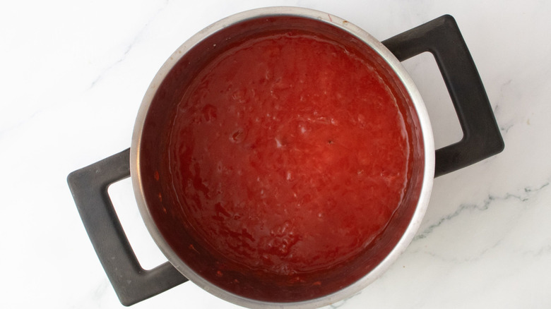 Mashed strawberry mixture in pot