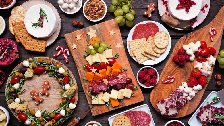 Spread of meats, cheeses, olives, fruit, nuts