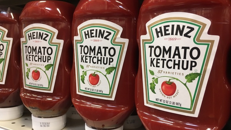 bottles of Heinz ketchup on shelf