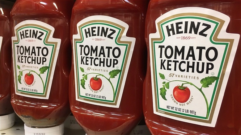 Three Heinz tomato ketchup bottles