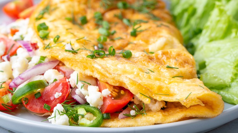 closeup of omelet with veggies