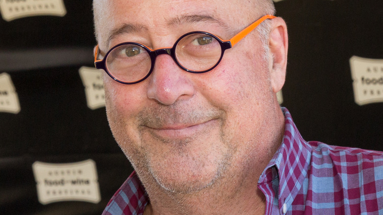 Andrew Zimmern smirking 