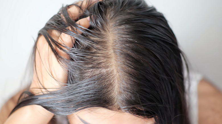 Woman running fingers through hair