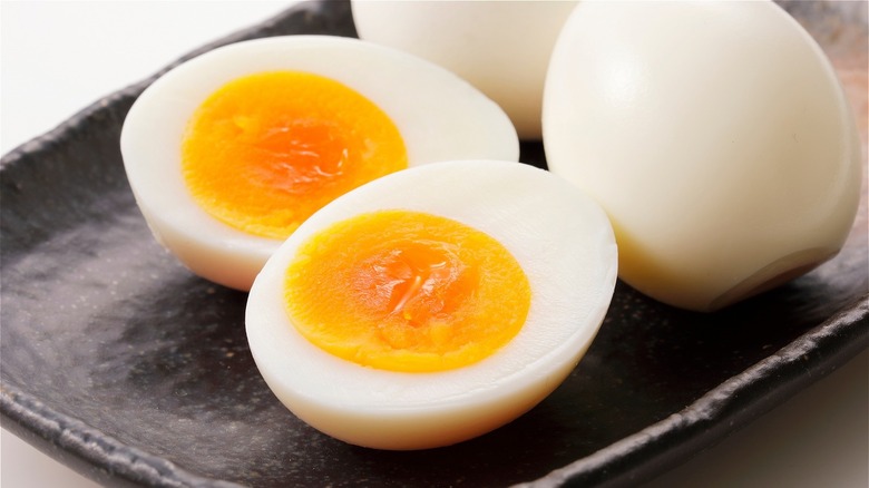 Soft-boiled eggs cut open to show yolk