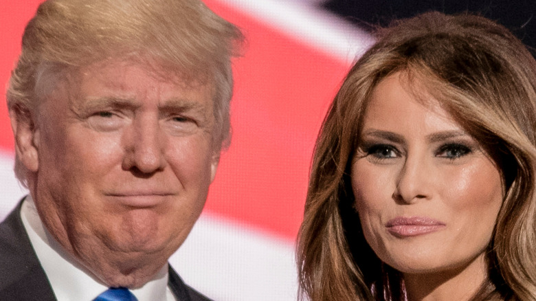 Donald and Melania Trump smirking