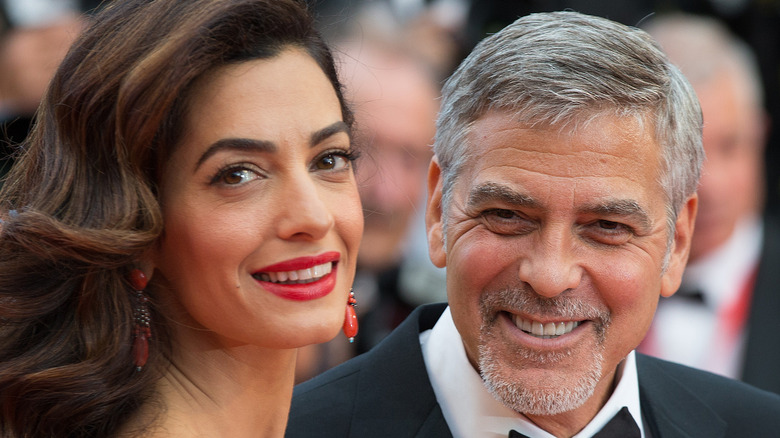 George and Amal Clooney smile