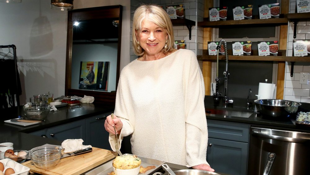 Martha Stewart eating in the kitchen