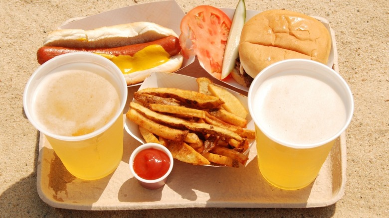 fries, hot dog, hamburger, and beers