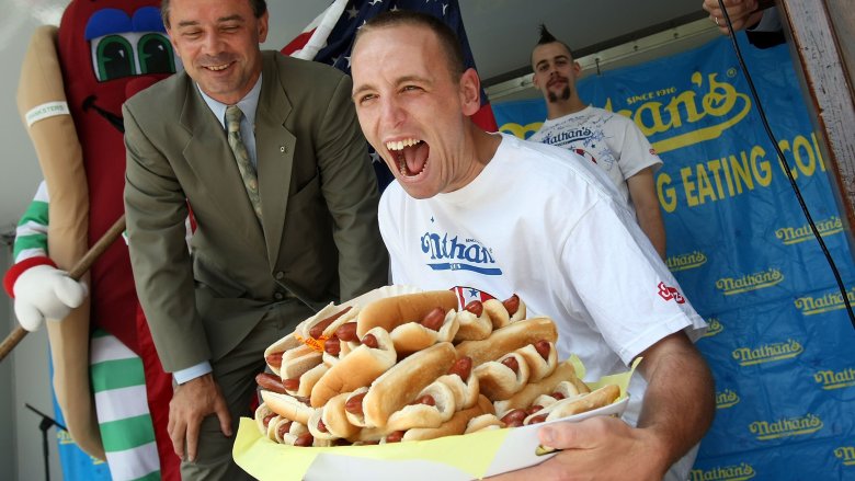 joey chestnut with hot dogs