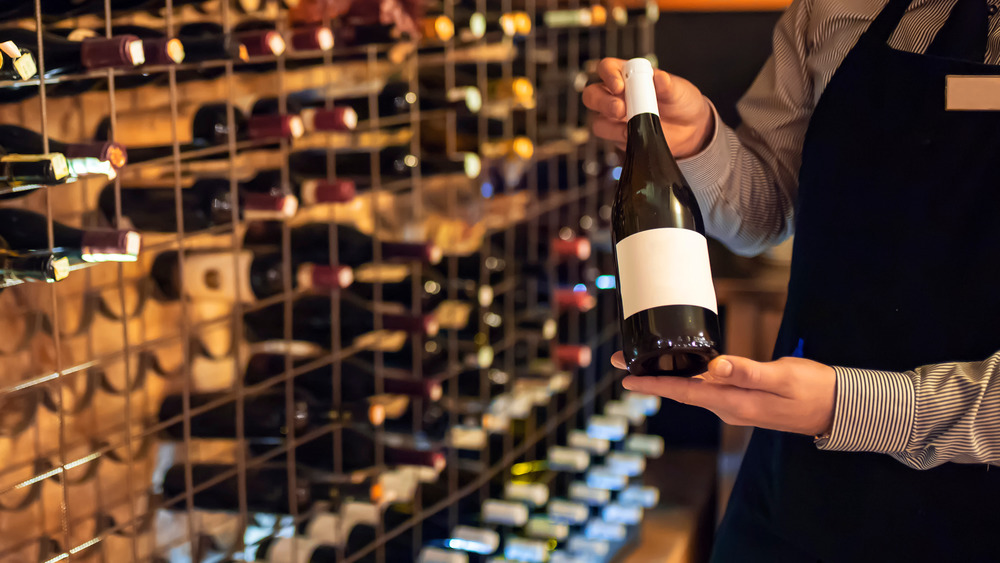 presenting a bottle of wine