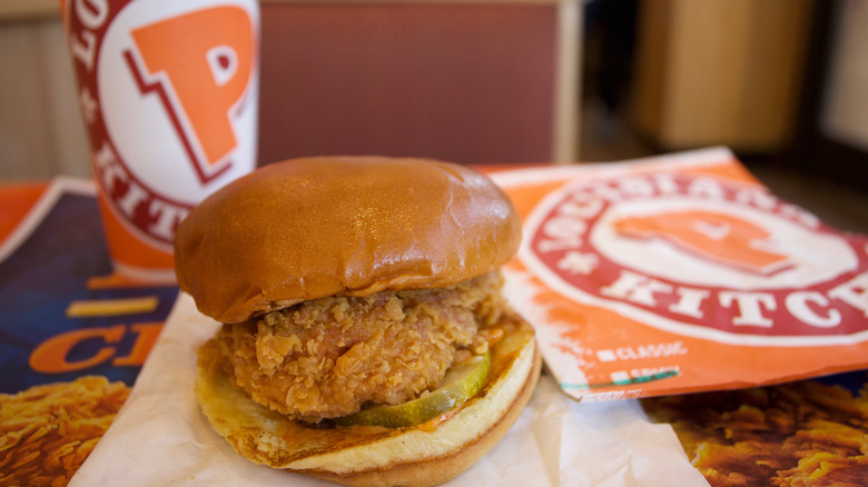 Popeyes chicken sandwich on table